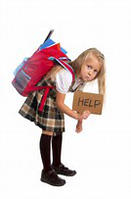 Child with heavy backpack with help sign stock photo