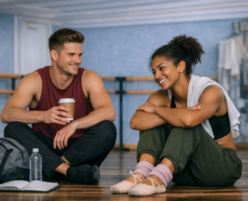 dancers sitting and talking in studio after practice