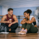 dancers sitting and talking in studio after practice